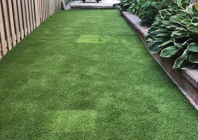 Side of the house fake grass install